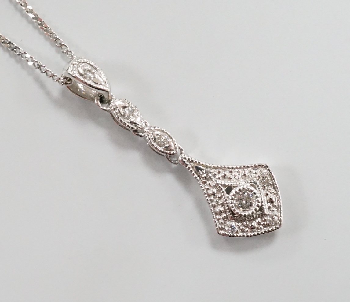 A modern 375 white metal and diamond chip set drop pendant, 23mm, gross 0.6 grams on an 18ct white gold chain, 46cm and one other 18ct white gold chain, 40cm, 18ct gross 2.9 grams.